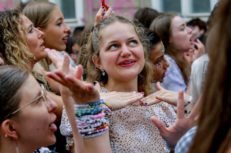 Swifties gather and sing in the city centre in Vienna on Thursday after the cancellation