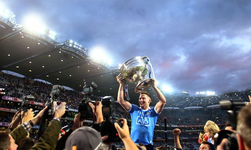 Dublin's Philly McMahon holds the Sam Maguire aloft in front of Hill 16 after their win in this year's All-Ireland final replay at Croke Park<br />Picture by S&eacute;amus Loughran