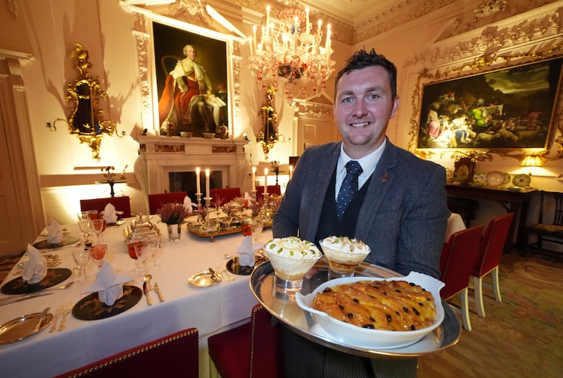 Evan Samson, who leads the front of house team at Dumfries House, with lemon and pistachio syllabub, bread and butter pudding alongside an apple and almond trifle in the Pink Dining Room