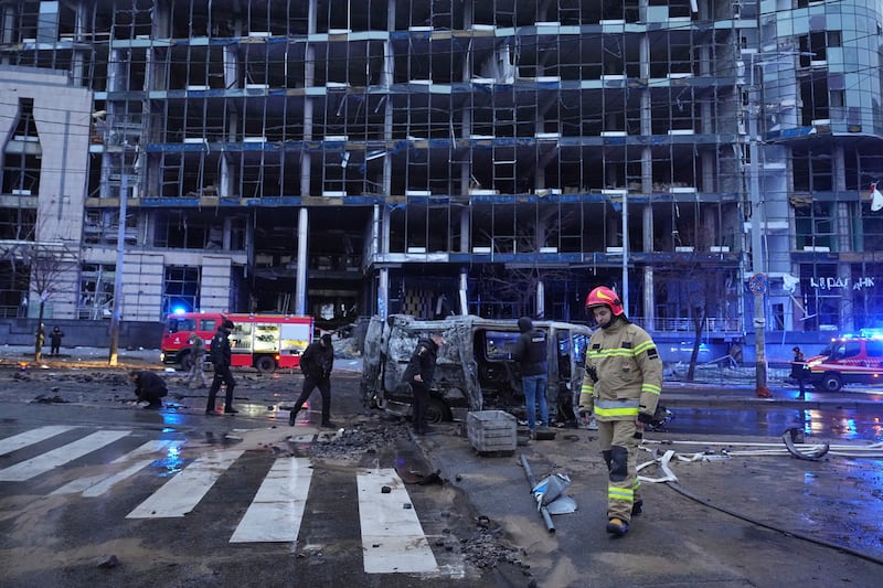 Emergency personnel following a Russian missile attack in Kyiv (Efrem Lukatsky/AP)