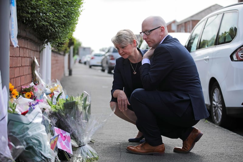 Home Secretary Yvette Cooper and Patrick Hurley, the Labour MP for Southport look at tributes near the scene in Hart Street, Southport, where three children died in a “ferocious” knife attack