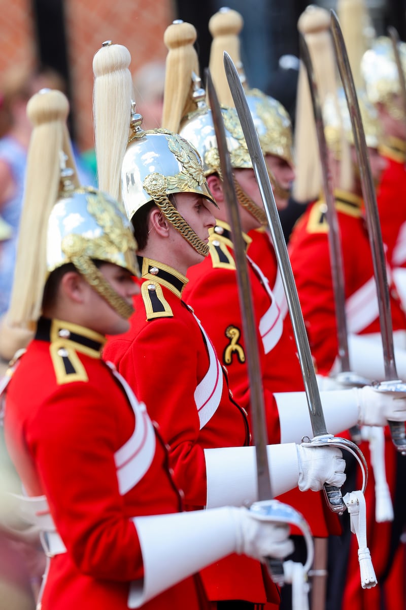Members of the Household Cavalry Regiment stand to attention at Windsor Castle