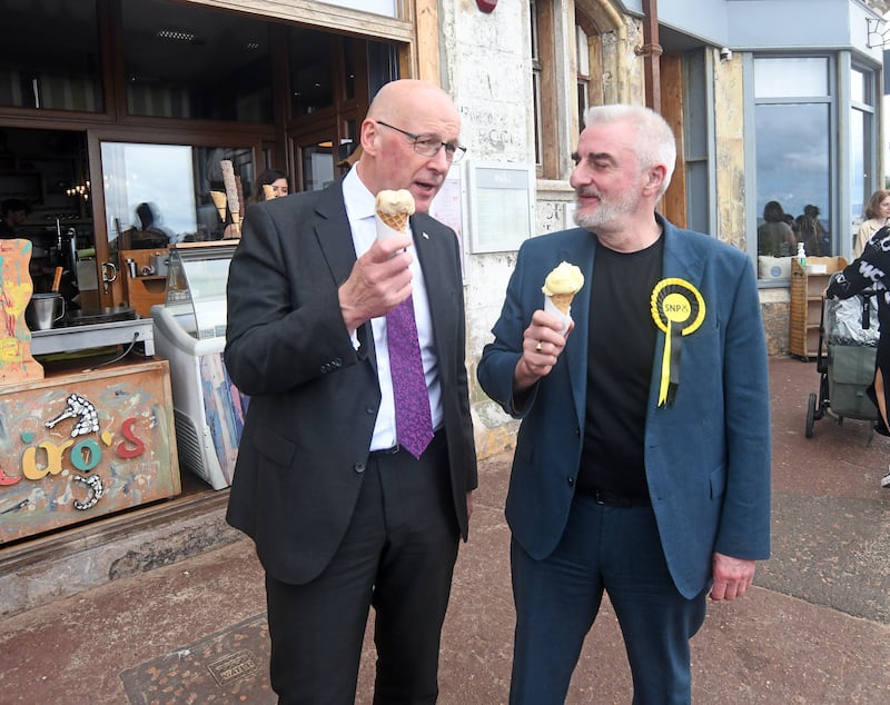 Scottish First Minister and SNP leader John Swinney (left) spoke out while campigning in Portobello in edinburgh with Edinburgh East and Musselburgh candidate Tommy Sheppard (right). Michael Boyd/PA)