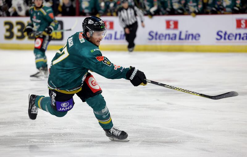 Belfast Giant Josh Roach shooting the puck at the SSE Arena in Belfast