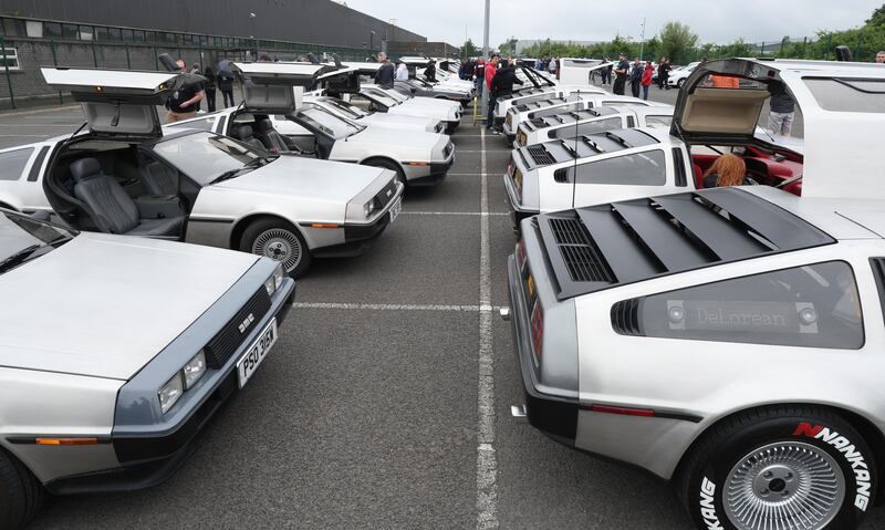 DeLorean owners gather at the Cutts in Dunmurry on Sunday as they drive on the old test track as part of the DeLorean Revival in Belfast.
PICTURE COLM LENAGHAN