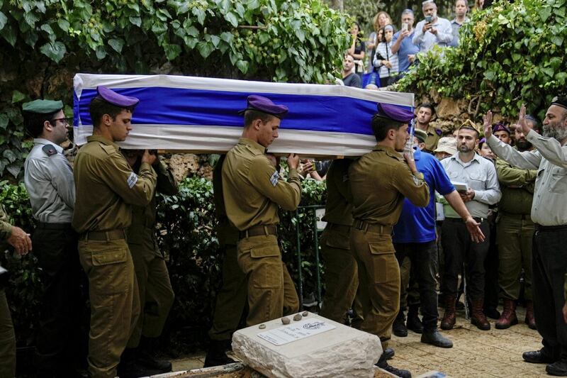Israeli soldiers carry the flag-draped casket of Staff Sgt Lavi Lipshitz during his funeral in the Mount Herzl Military Cemetery in Jerusalem. Lipshitz was killed during a ground operation in the Gaza Strip 