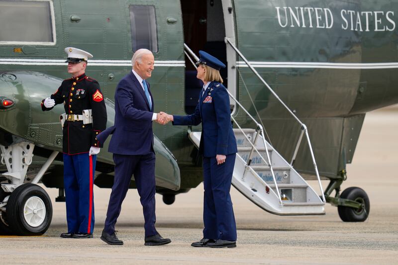 President Biden is greeted by Col Angela Ochoa, Commander of the 89th Airlift Wing Division, before he boards Air Force One at Andrews Air Force Base, en route to Florida (Jess Rapfogel/AP)