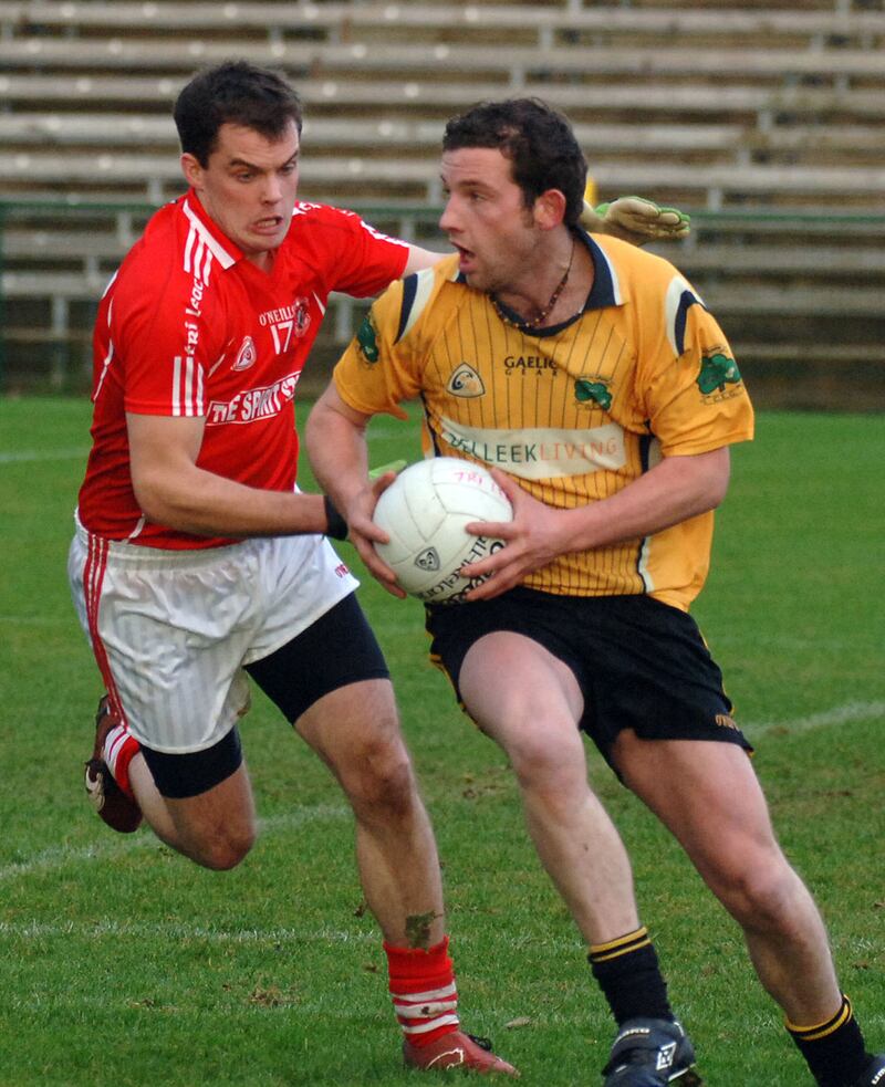 Erne Gaels Mark Lyons looks for options at Trillick's Fergal Donnelly closes in during the Ulster club championship final at Enniskillen yesterday. pic pat mc sorley