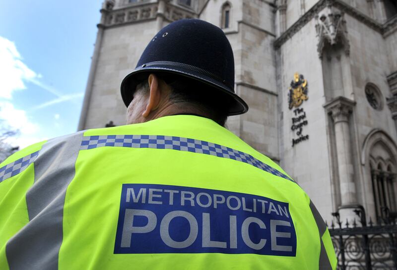 A Metropolitan Police Service (MPS) officer outside the Royal Courts of Justice in central London