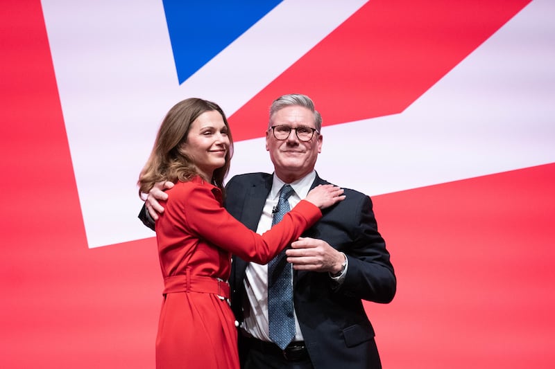 Prime Minister Sir Keir Starmer is joined on stage by his wife Victoria