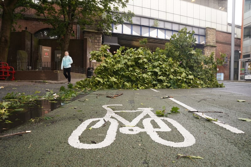 A tree branch blocks a cycle path in Leeds city centre as Storm Lilian hit the UK on Friday