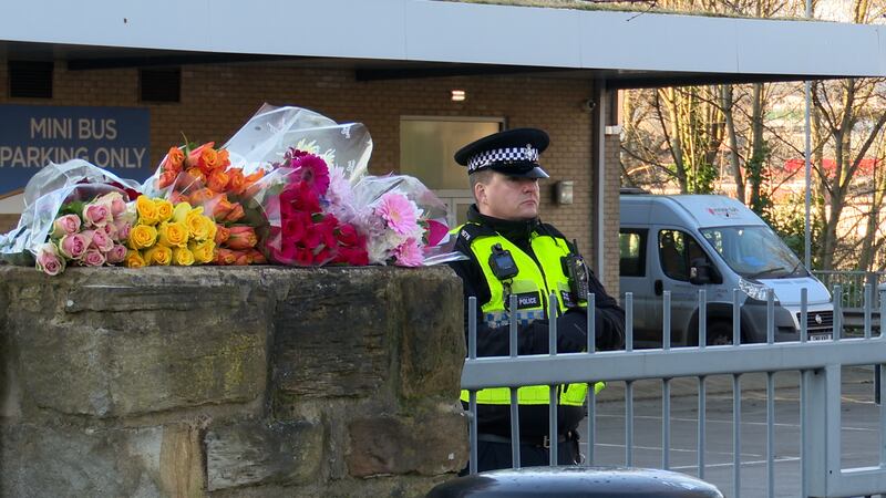 Floral tributes left outside All Saints Catholic High School