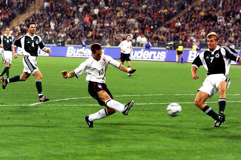 England’s Michael Owen beats Marko Rehmer, right, to score his hat-trick and England’s fourth goal in their 5-1 win over Germany