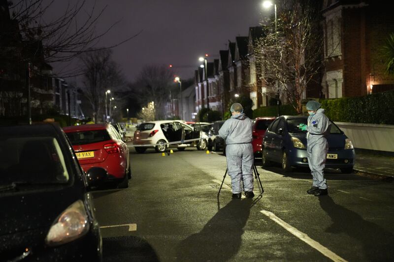Police attend the scene in Lessar Avenue near Clapham Common, south London, where the mother and her children were hurt