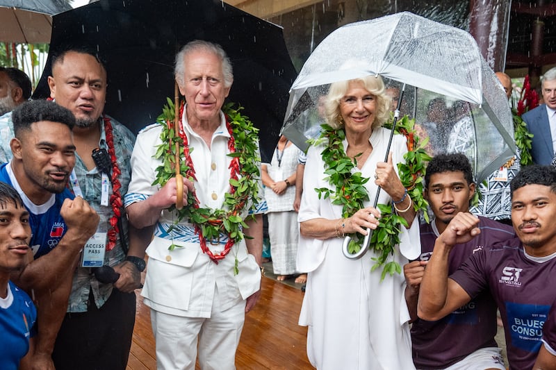 Charles and Camilla with members of the Apia rugby team in Samoa in October