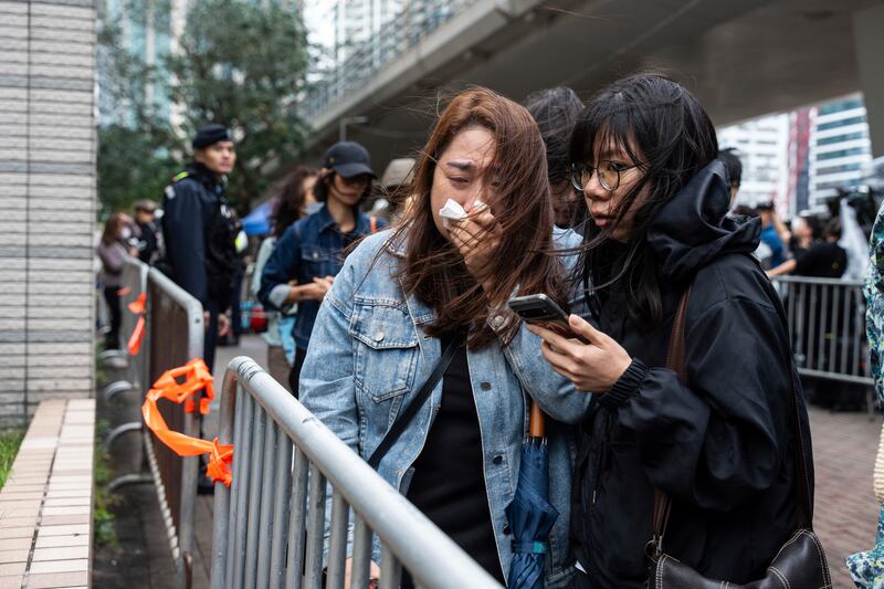 People gathered outside the court following the sentencing (Chan Long Hei/AP)