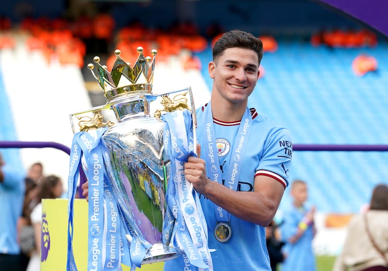 Alvarez celebrates with the Premier League trophy following City’s 2022-23 title success