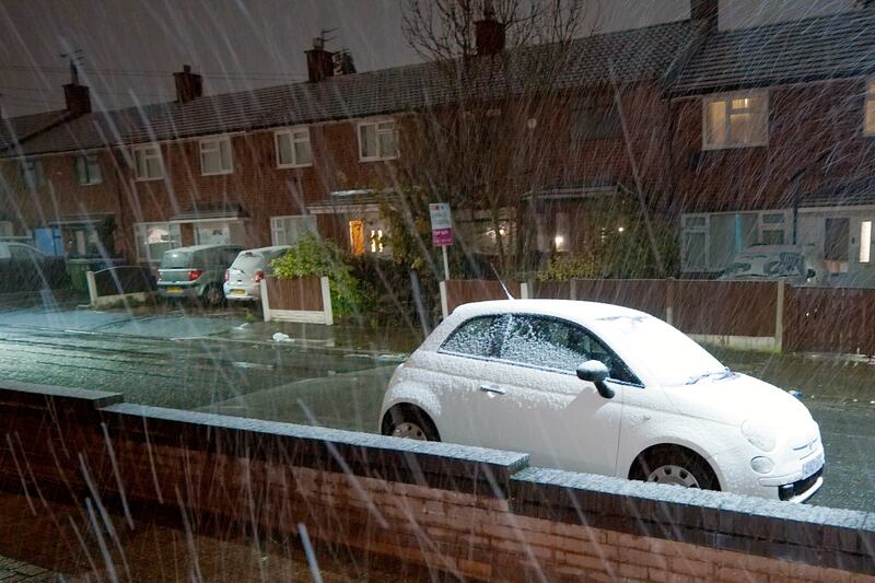 Snow begins to fall in Lee Park, Liverpool