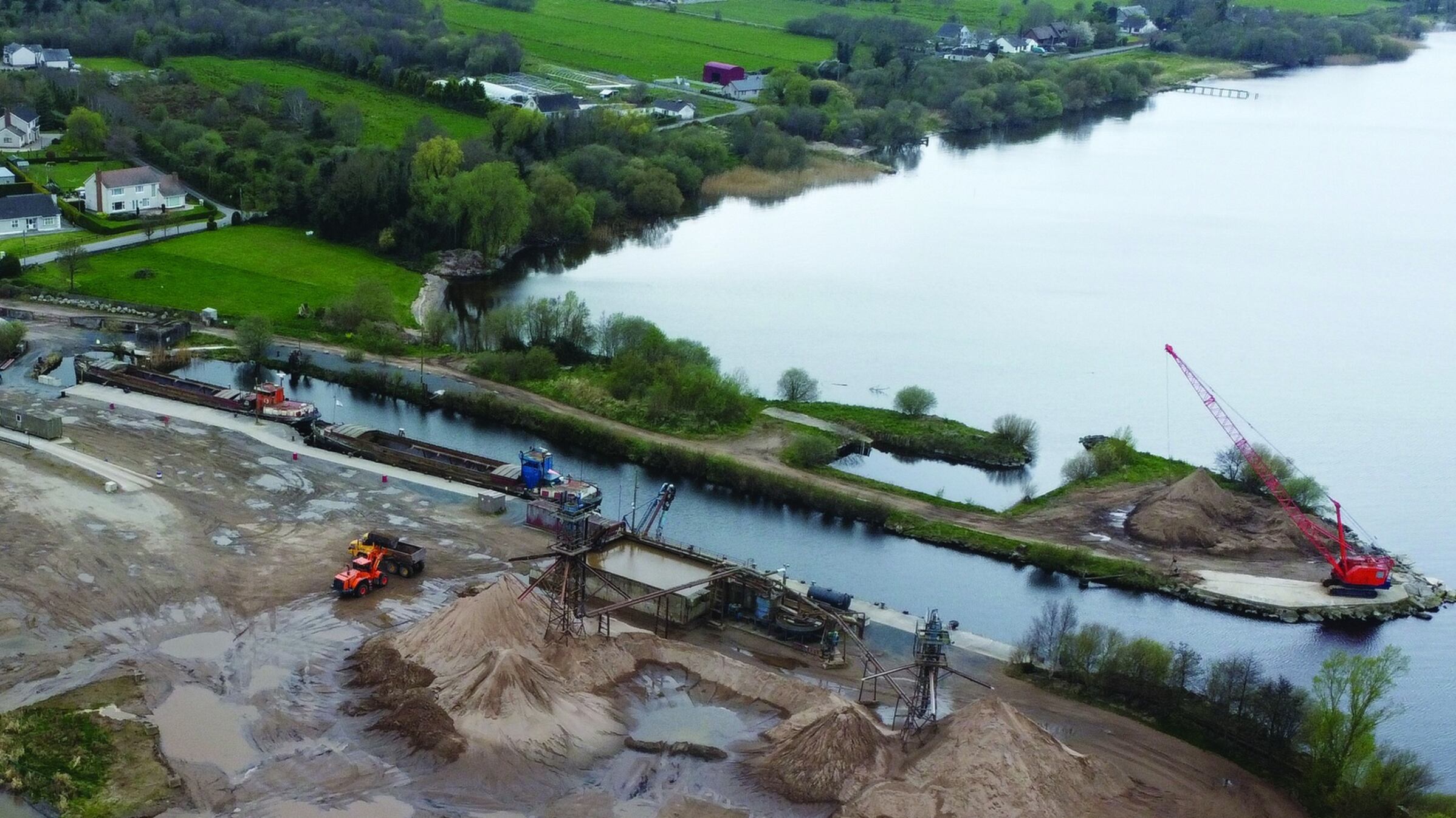 Aerial view of sand extraction operation on shore of Lough Neagh.