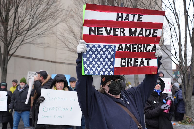 People protest outside a courthouse in Pittsburgh, US (Gene J Puskar/AP)