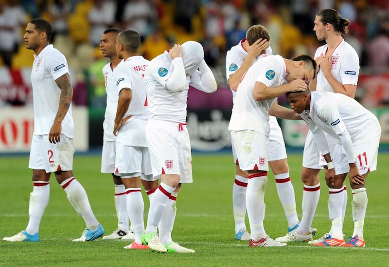 England’s Ashley Young is consoled by John Terry after England lose the penalty shoot-out against Italy at Euro 2012 (Anthony Devlin/PA)