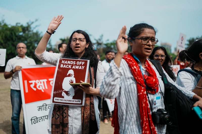 Indians protesting against the rape and killing of a trainee doctor (Rafiq Maqbool/AP)