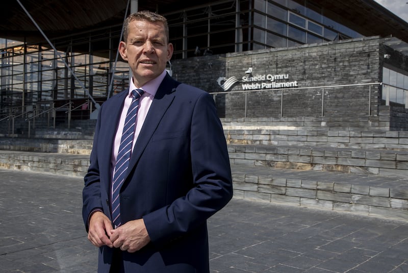 Leader of Plaid Cymru Rhun ap Iorwerth stands outside the Senedd