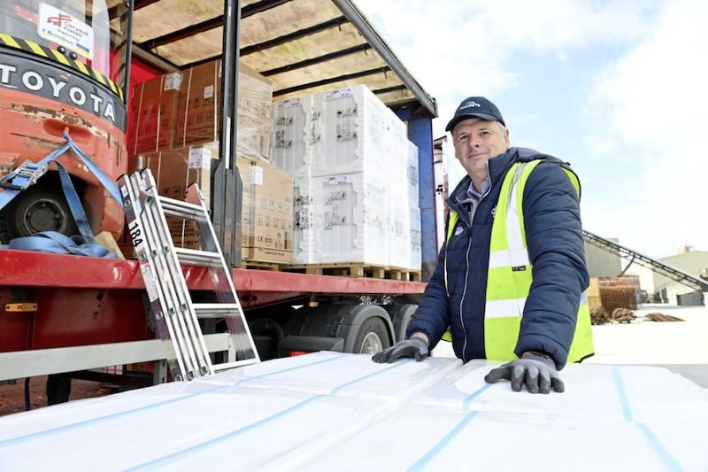 Macrete Ireland director Richard Hogg helps load a lorry full of goods including washing machines and a forklift truck ahead of driving it to the Ukranian border next week. 