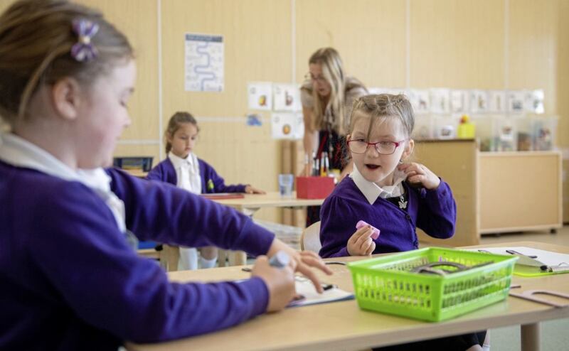 Reception pupils Eden and Teegan at Queen's Hill PS, Costessey, Norfolk, as pupils begin to return to school in England