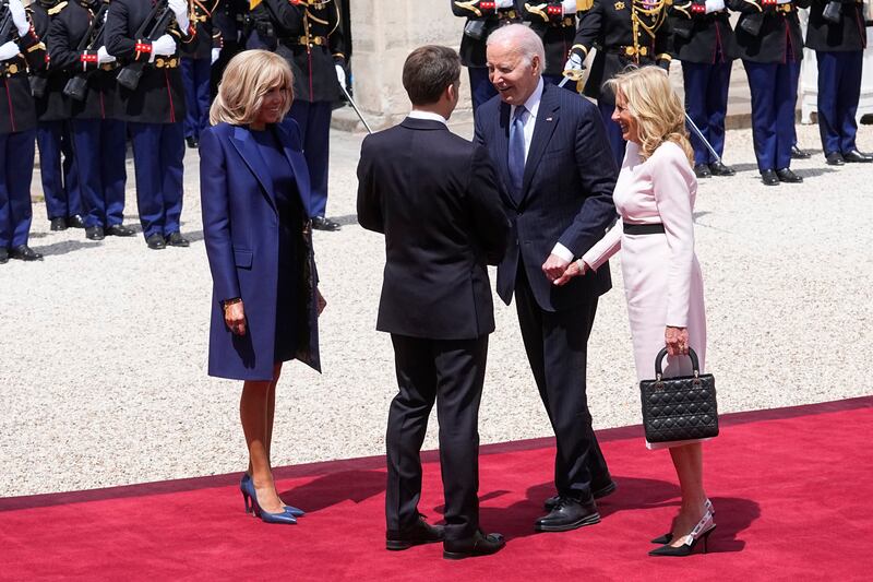 Mr Macron and his wife Brigitte welcomed the US President and first lady at the start of the state visit (AP)
