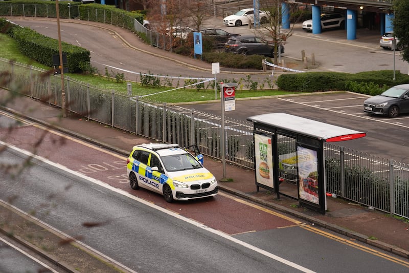 A police car next to a bus stop on Woolwich Church Street where Kelyan died