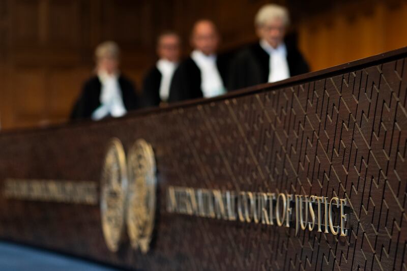 Judges enter the International Court of Justice (Peter Dejong/AP)