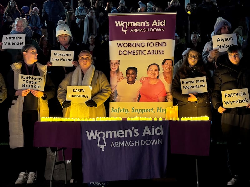 People take part in a vigil organised by Women’s Aid Down Armagh at Solitude Park in Banbridge