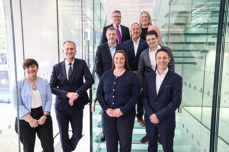 EY Northern Ireland Audit partner group at their Bedford House offices. Front row (L-R) Danielle Smyth, Michael Kidd, Lindsay Russell, Mark Lawther. Middle row (L-R) Neil Warnock, Neil Corry, Andrei Mankov. Back row (L-R) Michael Christie, Sara McGreer. PIC. PressEye