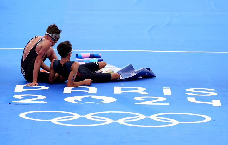 Great Britain’s Alex Yee with New Zealand’s Hayden Wilde following the men’s triathlon