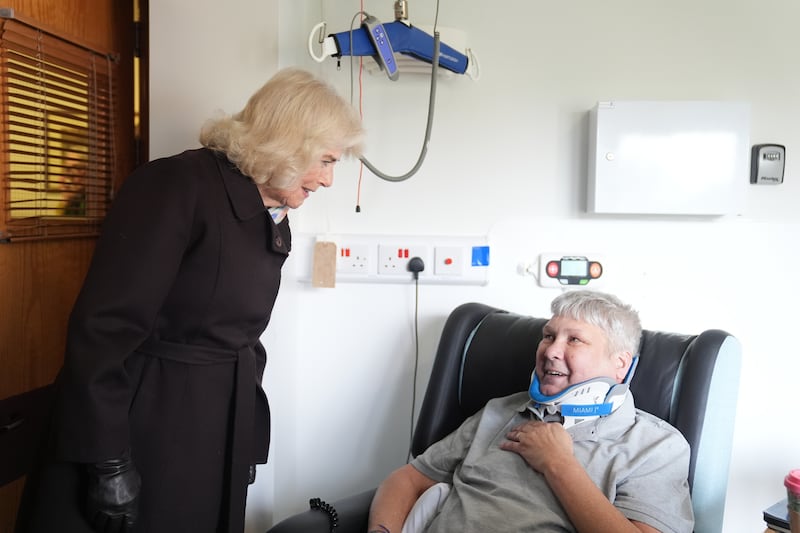 Queen Camilla speaks to patient Christopher Southall