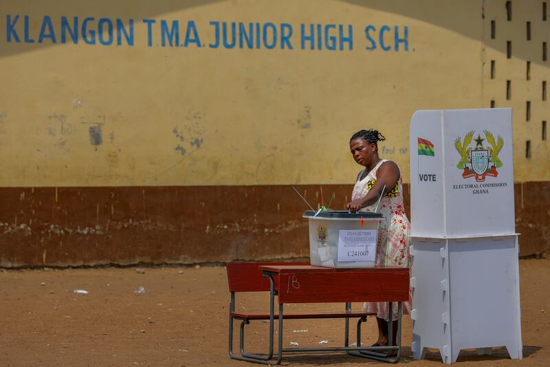 A woman casts her ballot at a polling station in Jamestown, Accra (Misper Apawu/AP)