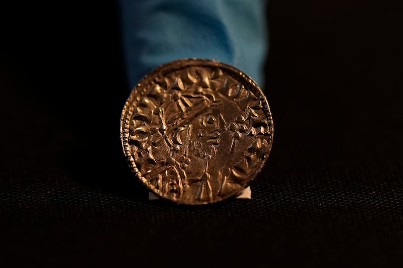 An Edward the Confessor Pyramid coin (1065-6), part of the Chew Valley Hoard of 2,584 coins found buried in Somerset, on display at the British Museum in London (Alastair Grant/AP)