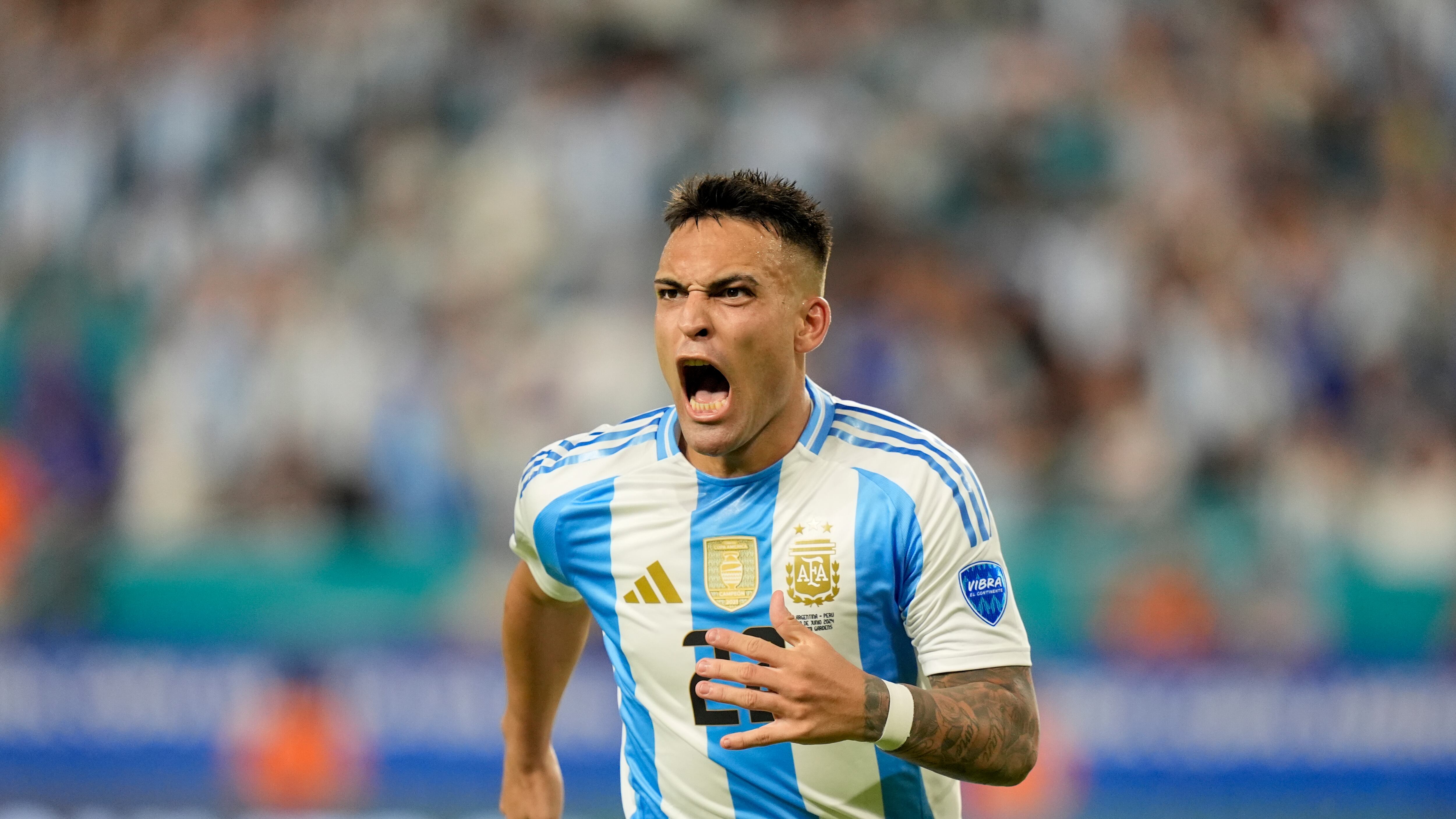 Argentina’s Lautaro Martínez celebrates scoring his side’s opening goal against Peru (Lynne Sladky/AP)