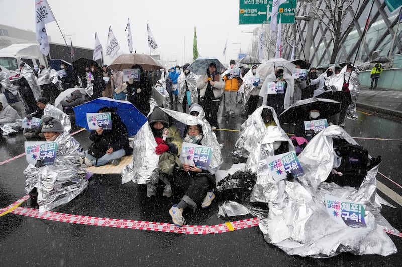 Protesters attend a rally demanding the arrest of impeached South Korean President Yoon Suk Yeol near his presidential residence (Ahn Young-joon/AP)