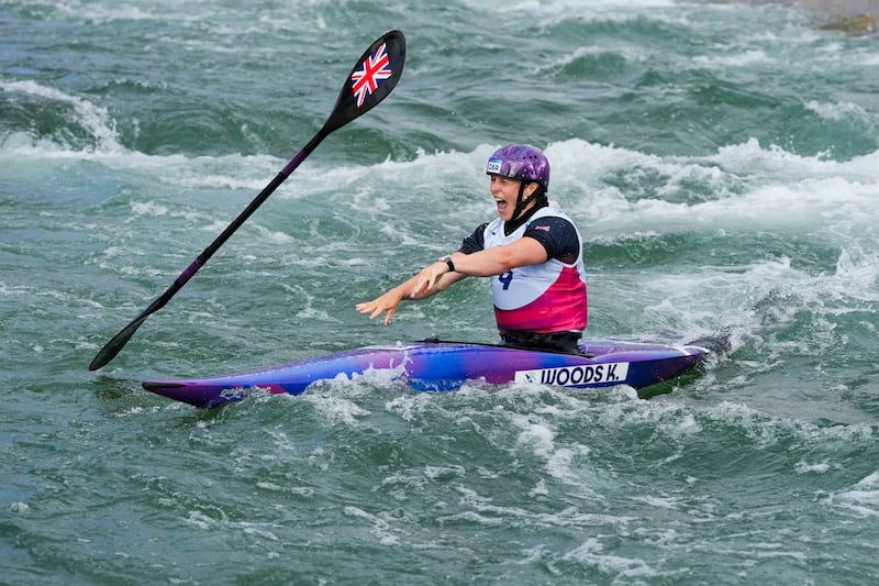 Kimberley Woods threw her paddle in joy after securing bronze