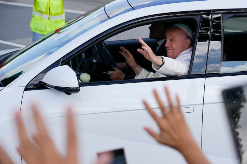 Pope Francis waves as he arrives at Catholic Junior College during his last day of a visit to Singapore (Vincent Thian/AP)