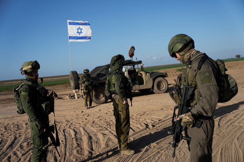 Israeli soldiers are seen near the Gaza Strip border in southern Israel (Ohad Zwigenberg/AP)