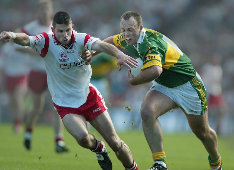 Ann McManus' shot of Kerry's John Crowley fending off a challenge by Tyrone's Ciaran Gourley during the 2003 All-Ireland semi-final in Croke Park.