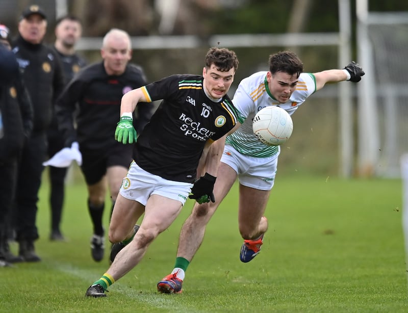 Ryan Jones of Dungannon in action against Michael McCallan of Carrickmore in the Tyrone League Division One final at Augher       Picture: Oliver McVeigh