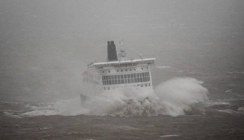 A DFDS ferry arrives in stormy conditions at the Port of Dover in Kent