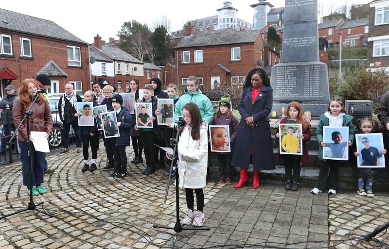 Children related to the Bloody Sunday victims hold images of children killed in the ongoing war in Gaza. Pictured are Eadaoin Pike, grand niece of Michael McDaid and Aoibheann Wray, grand niece of Jim Wray.  A minute's silence was observed at the Bloody Sunday Monument in the Derry Bogside on Thursday where families gathered to remember the exact time 53 years ago where the british soldiers killed innocent marchers on the streets during the 30th January 1972. When the shooting stopped that day, 13 men and boys had been murdered with many more people injured. The Silence and ceremony was dedicated this year to the children of Gaza. Picture Margaret McLaughlin