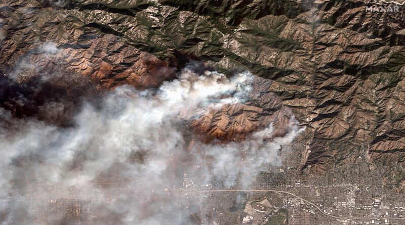 A satellite image showing the Eaton fire burning in and near Altadena (Maxar Technologies via AP)