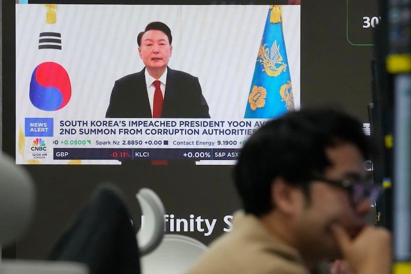 A TV screen showing Yoon Suk Yeol (Ahn Young-joon/AP)