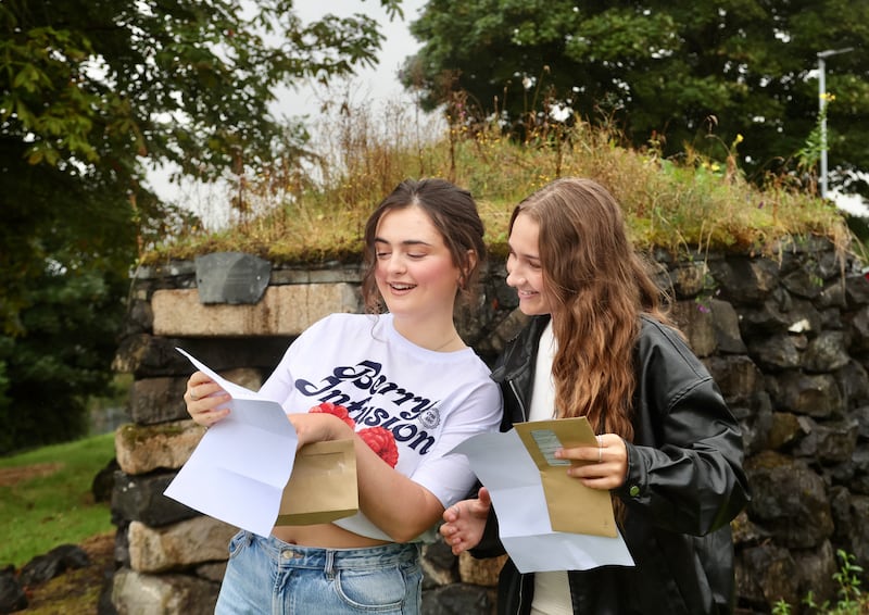 Anna-Marie Culleton  and Jodie McCracken from Colaiste Feirste receive their A Level results.
PICTURE COLM LENAGHAN